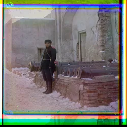 A Russian Soldier Stands Guard at a Palace Next to Old Cannons in Bukhara, 1915